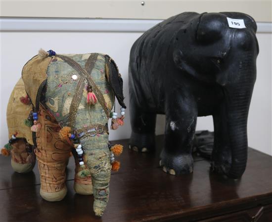 A large ebony elephant and Indian fabric elephant